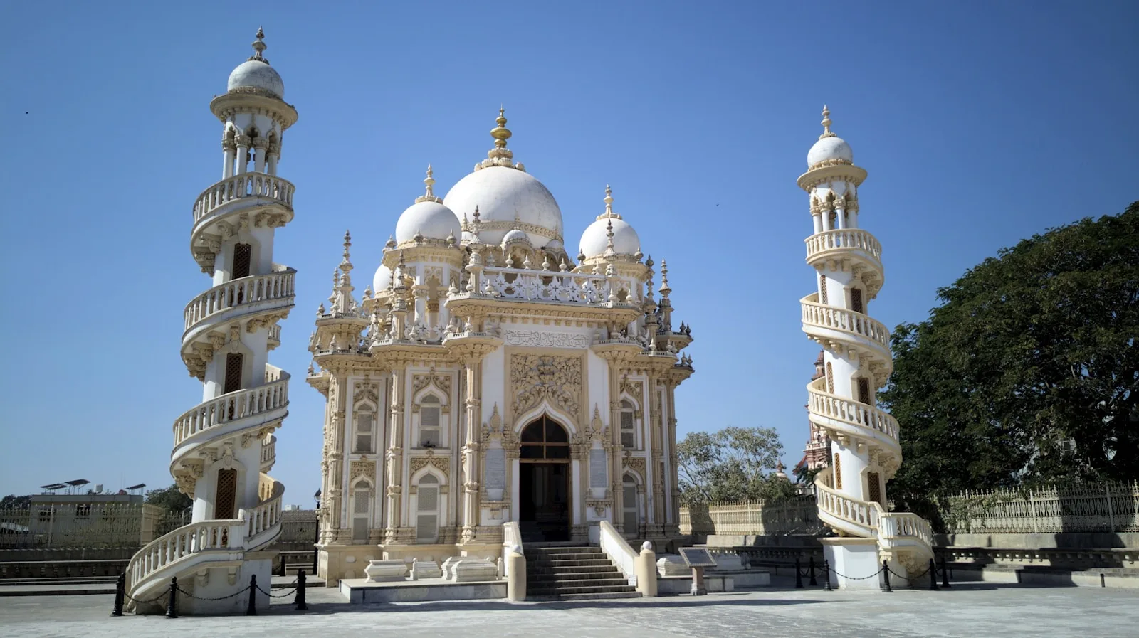 a large white building with a staircase leading up to it