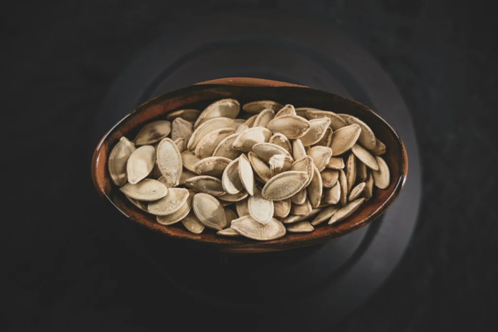 brown and white nuts on brown ceramic bowl