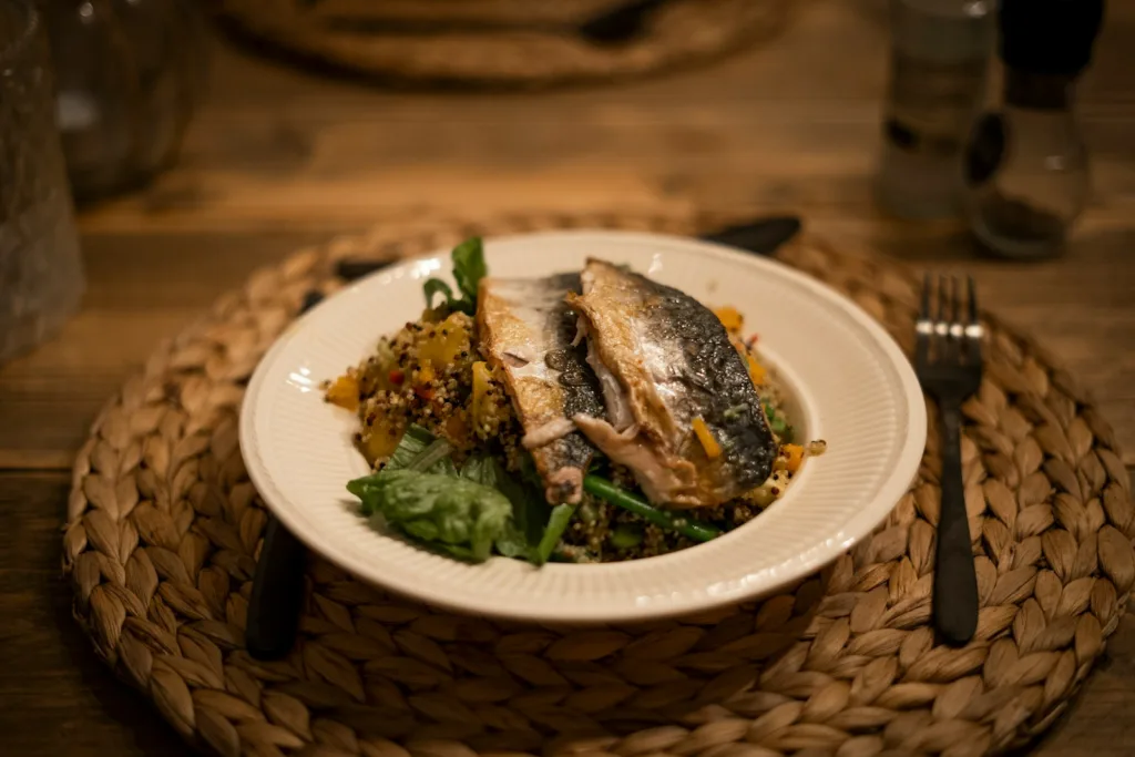 cooked fish on white ceramic plate