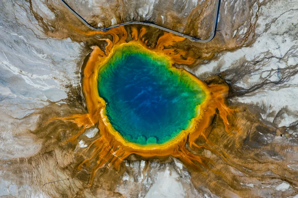 blue and yellow water on brown and gray surface