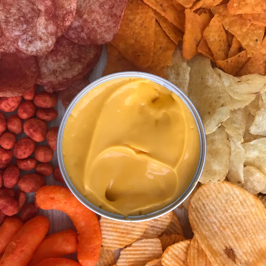 bowl of gravy beside crackers